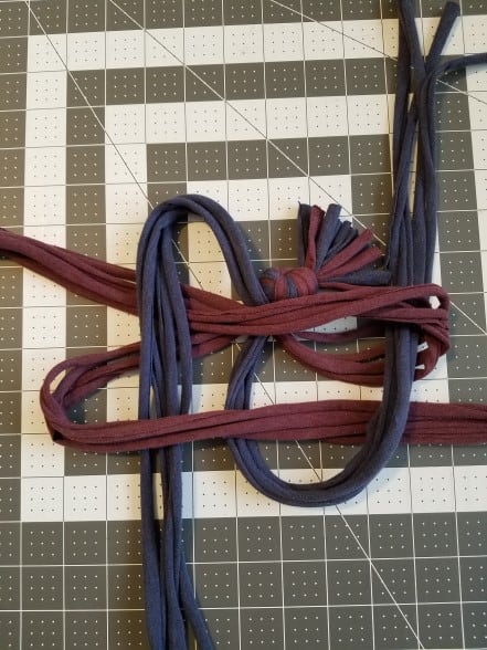 The right group of strips is over the folded up group and under the folded down group. The left group is over the down group and under the up group.