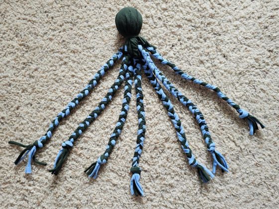 A tennis ball t-shirt toy.