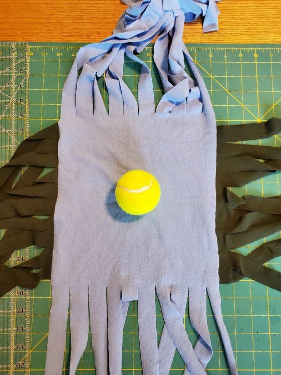 A tennis ball on the precut t-shirts.