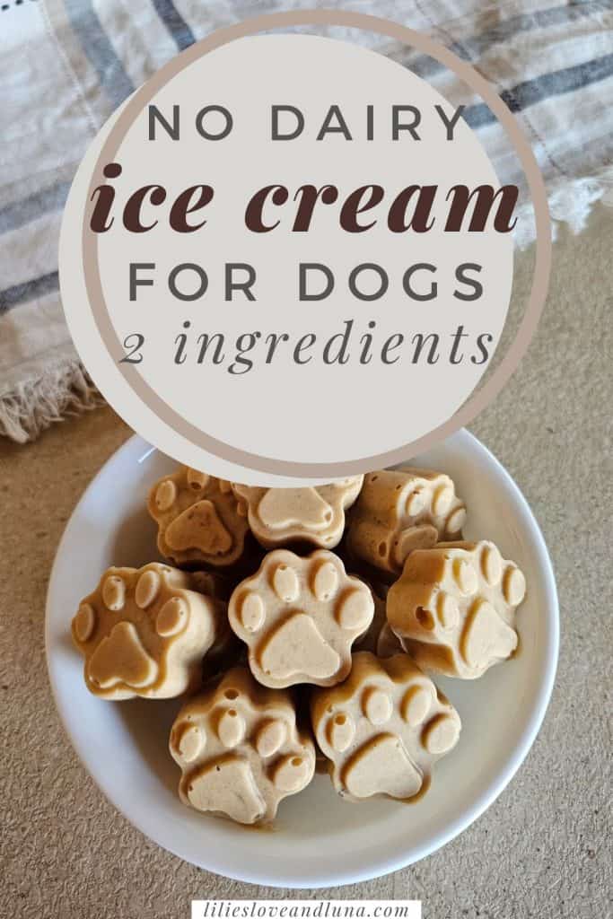 A bowl of frozen dog treats shaped like paw prints, made with banana and peanut butter, sits on a countertop alongside a textured cloth. A text overlay reads no dairy ice cream for dogs: 2 ingredients.