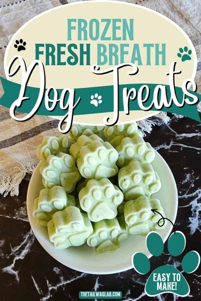 Homemade Frozen Fresh Breath Dog Treats in paw and bone shapes served in a white bowl. Pinterest pin text reads "Frozen Fresh Breath Dog Treats" and "Easy to Make!"