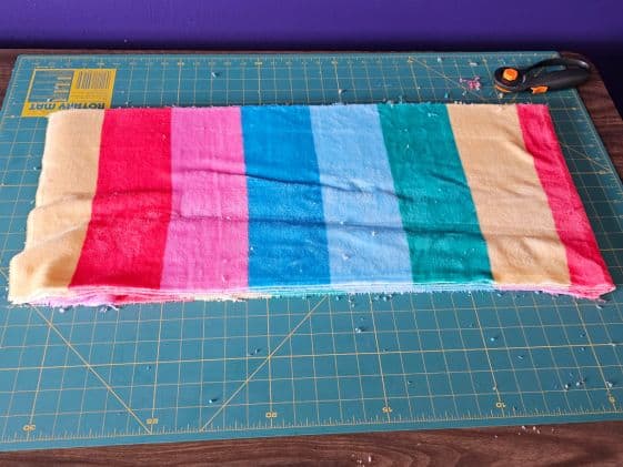 2 pieces of fleece stacked on top of each other and folded in half.