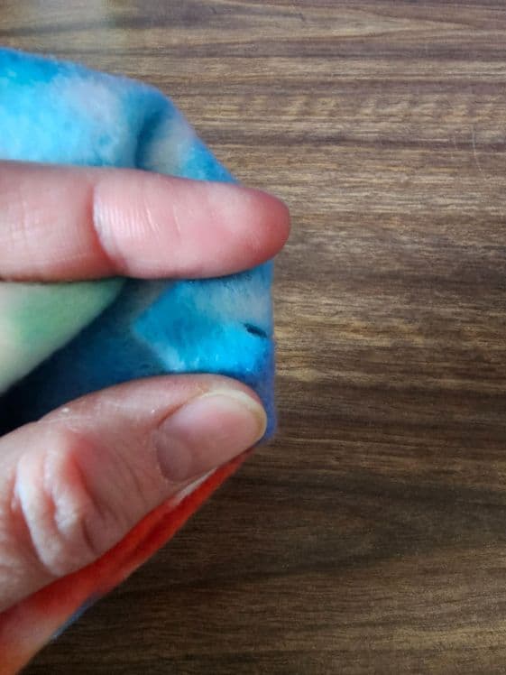 A small slit in the fabric.