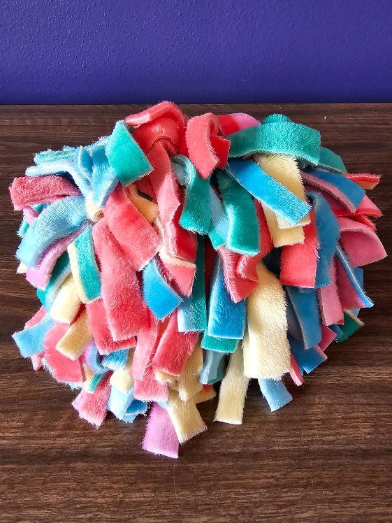 A finished fringe snuffle ball
