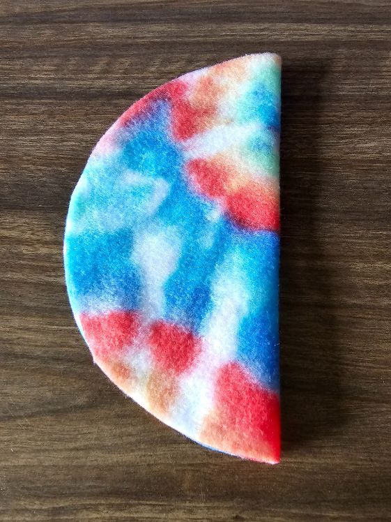 Fleece circle folded in half.