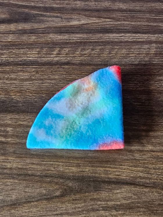 A fleece circle folded into a quarter circle.