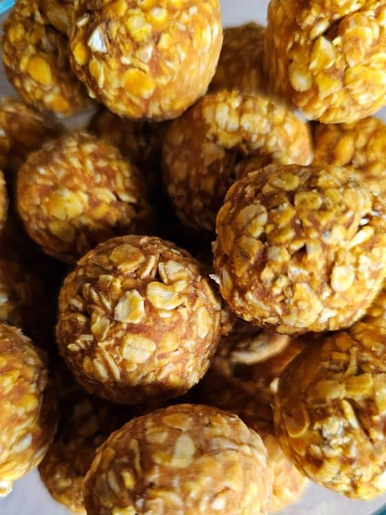 A close up of ball shaped pumpkin and yogurt dog treats.