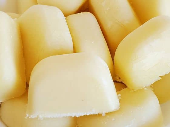 A close up image of frozen pineapple dog treats