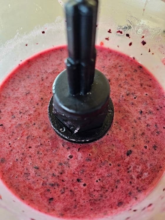 Banana berry puree in a food processor.