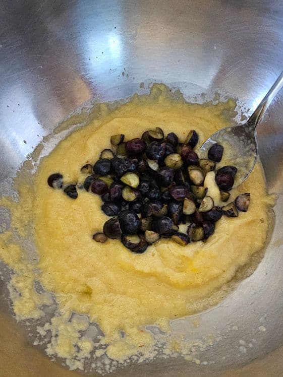 Blueberries added to the applesauce and egg mixture.