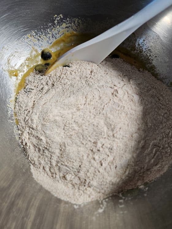 Flour added to the wet ingredients.