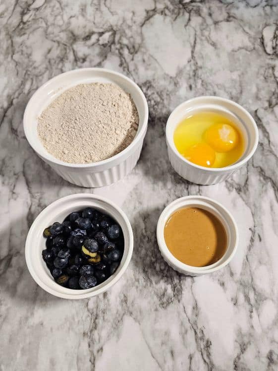 Ingredients for baked blueberry dog treats.