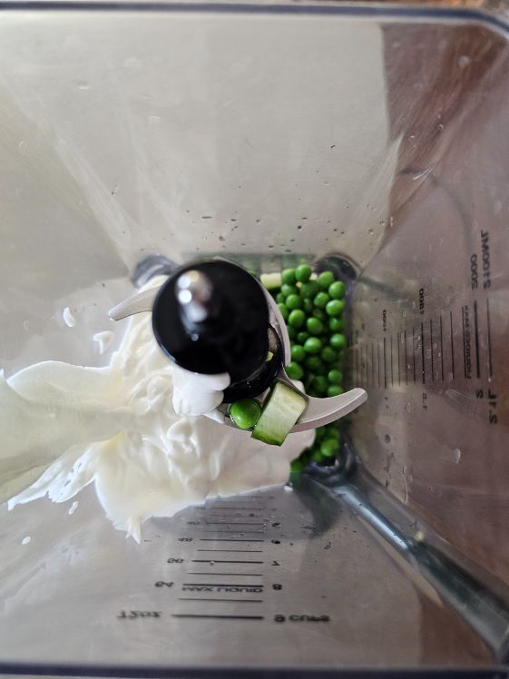 Cucumbers, peas, and Greek yogurt in a blender.
