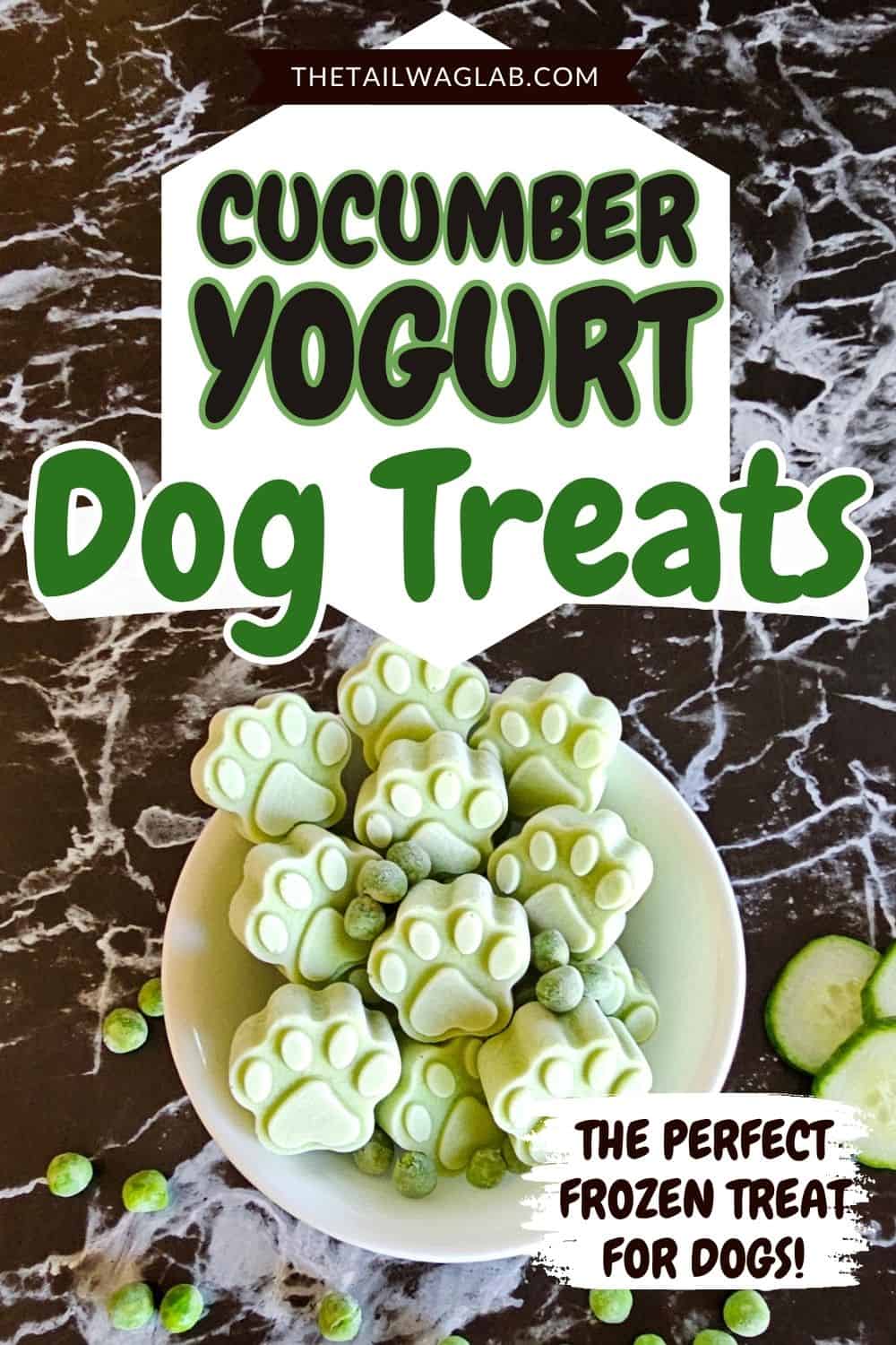 Bowl of green paw-shaped cucumber yogurt dog treats with cucumber slices and peas, with text reading “Cucumber Yogurt Dog Treats.”