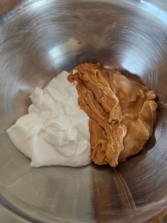 Greek yogurt and peanut butter in a bowl.