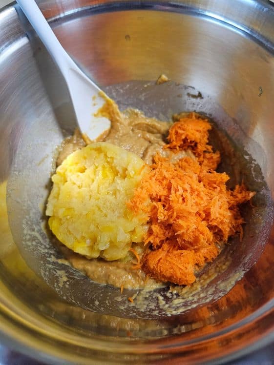 Pineapple and carrots added to wet mixture.