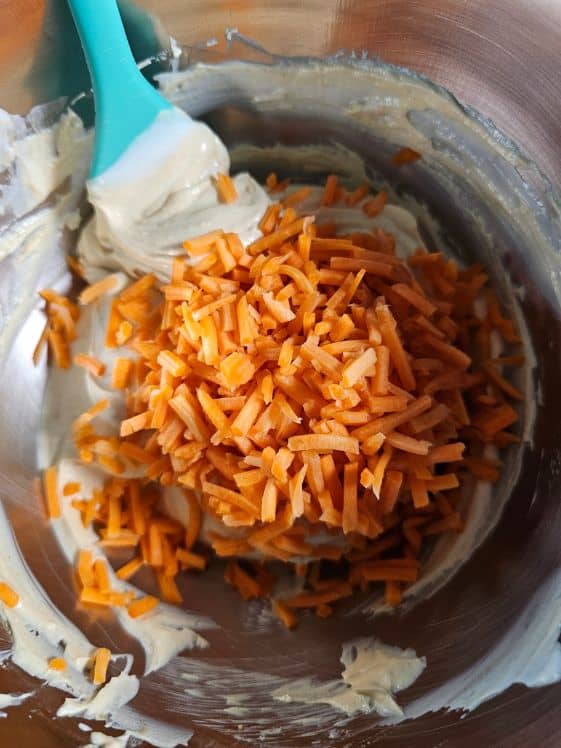 Shredded carrots added to peanut butter yogurt mixture.