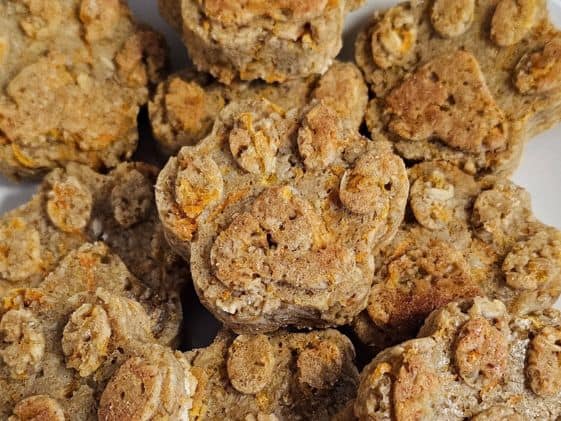 Close up of paw shaped carrot applesauce dog treats.