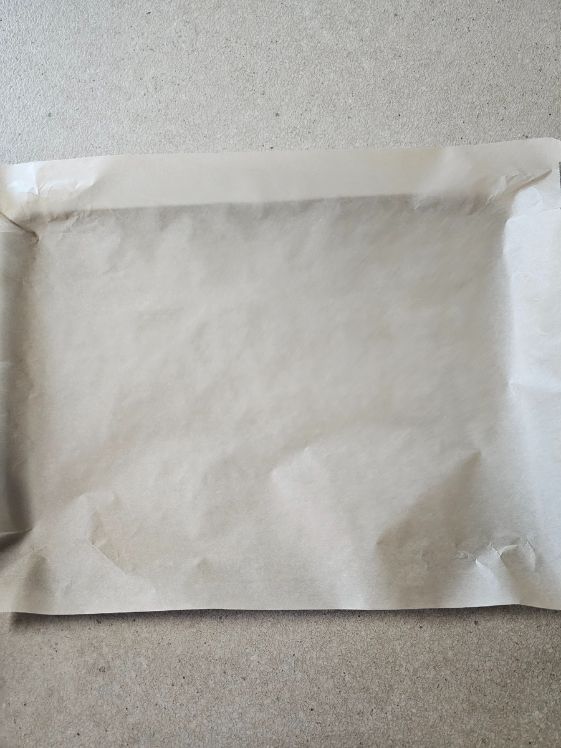 Parchment paper on a baking sheet.