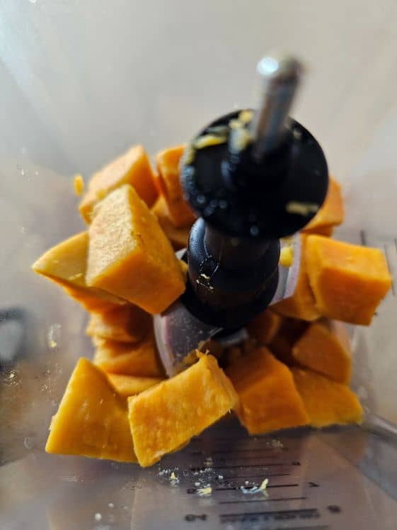 Boiled sweet potatoes in a blender.