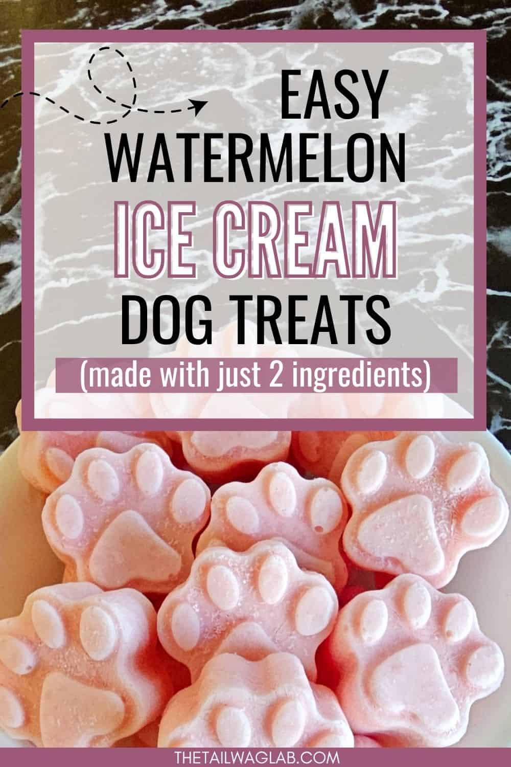 Paw shaped watermelon ice cream for dogs on a marble background with a text overlay that reads "easy watermelon ice cream dog treats (made with just 2 ingredients)."