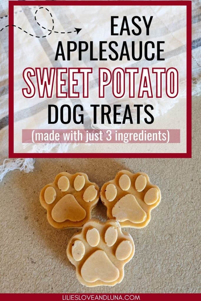 Three paw-shaped dog treats made with applesauce and sweet potato, placed on a surface with a textured cloth in the background, are labeled as "Easy Applesauce Sweet Potato Dog Treats (made with just 3 ingredients)."