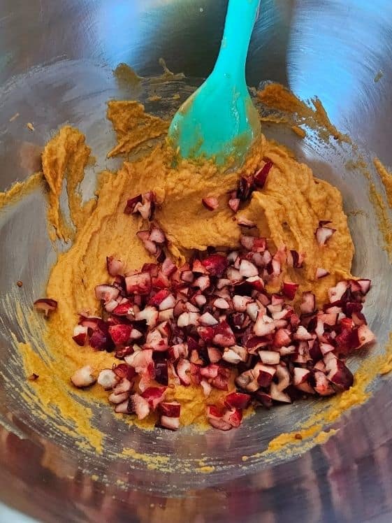 Chopped cranberries added to pumpkin and peanut butter mixture.