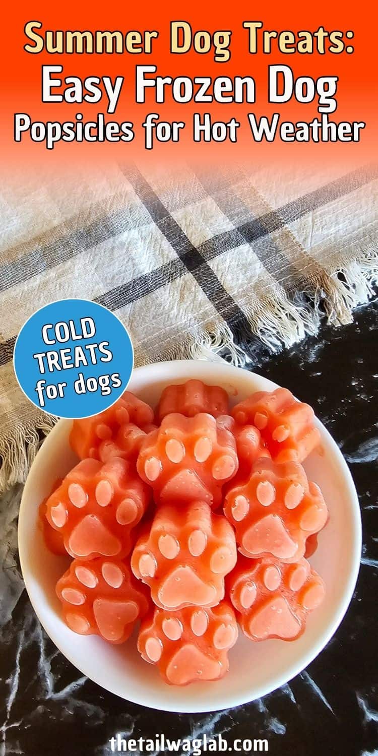 A bowl of paw-shaped frozen dog treats appears on a black surface, with the treats featuring a pink color, indicating they may be strawberry-flavored, and labeled as "easy homemade dog treats" suitable for hot weather.