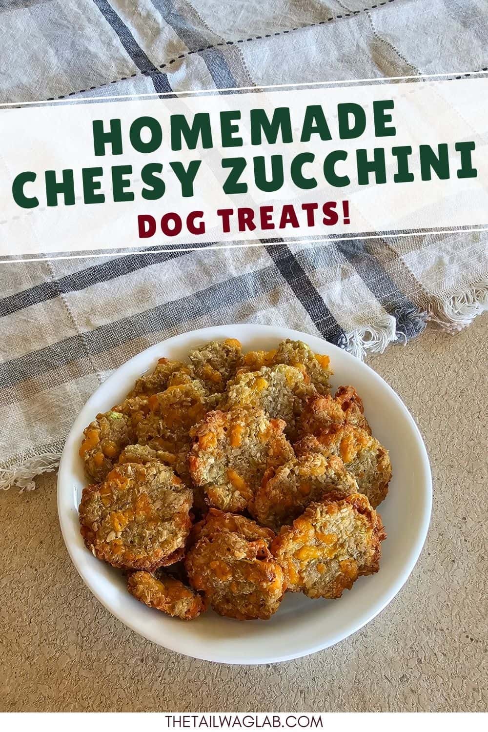 Pinterest pin showing a bowl of homemade cheesy zucchini dog treats with the text "Homemade Cheesy Zucchini Dog Treats!" and The Tail Wag Lab website name at the bottom.