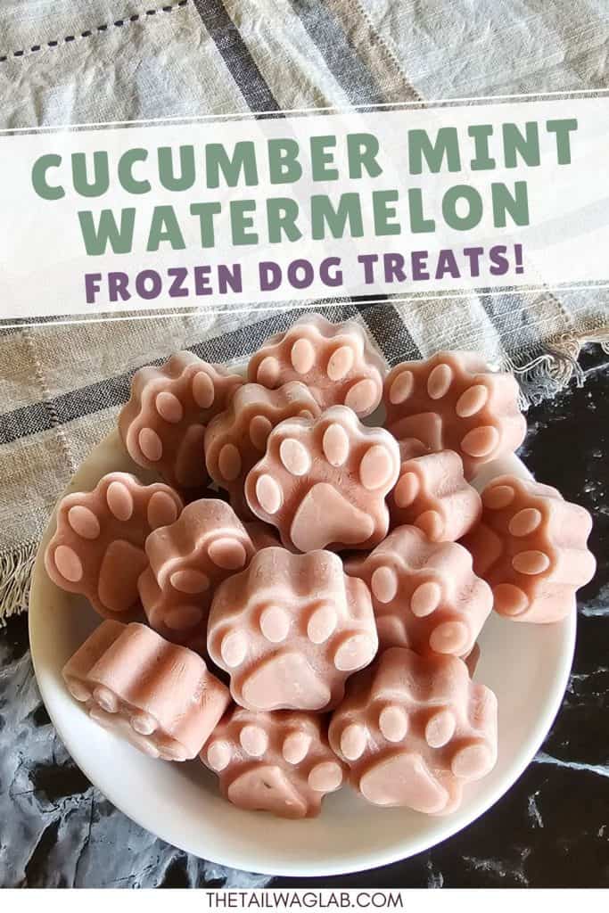 Bowl filled with pink paw-shaped cucumber watermelon mint frozen dog treats with text identifying the recipe as “Cucumber Mint Watermelon Frozen Dog Treats.”
