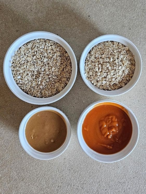 Quick oats, peanut butter, and sweet potato puree in individual white bowls.